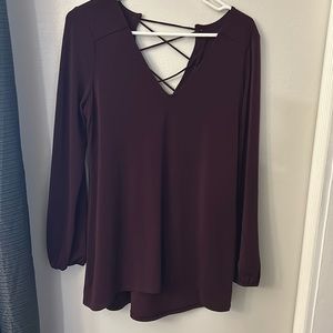 V neck tunic top with lace up back.